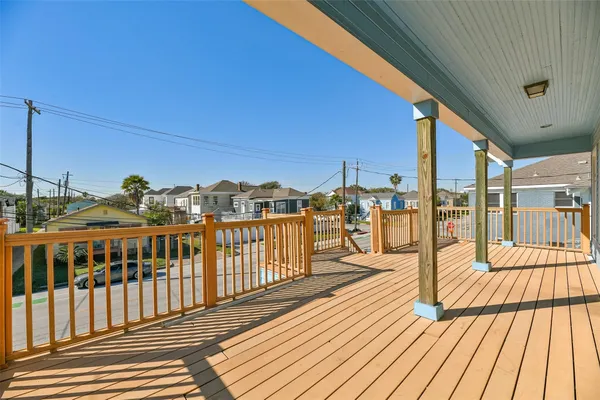 a view of a balcony with wooden floor