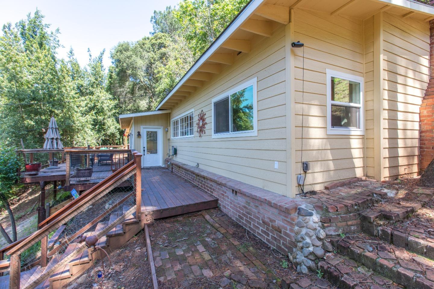 21477 Old Mine Road Los Gatos, CA 95033 - Photo 11 of 27 a view of a house with backyard and wooden deck