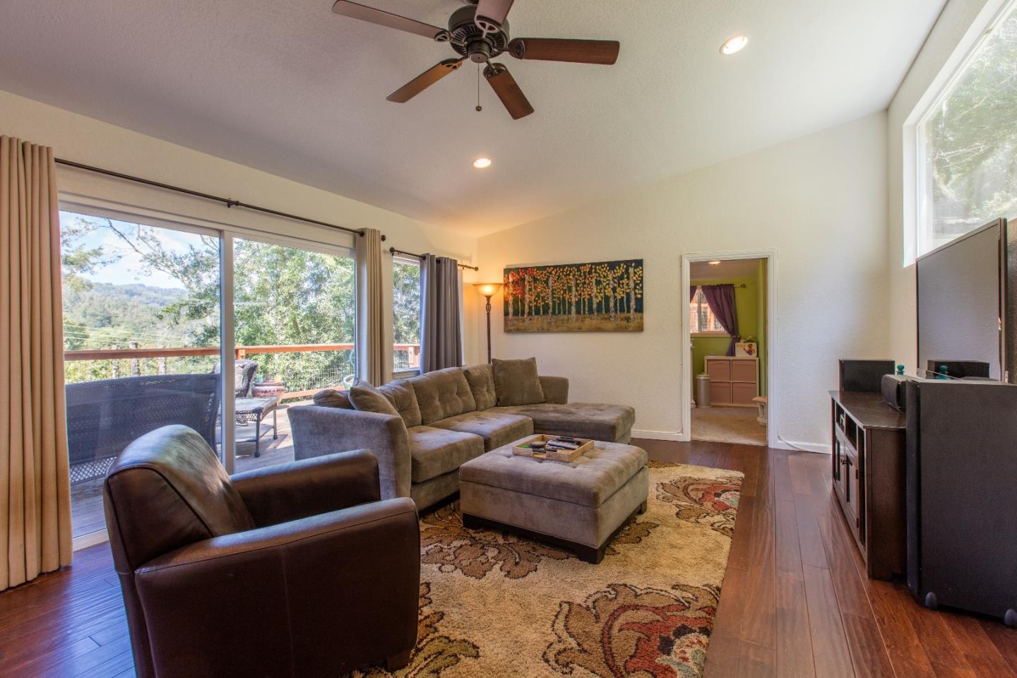 21477 Old Mine Road Los Gatos, CA 95033 - Photo 12 of 27 a living room with furniture and a large window