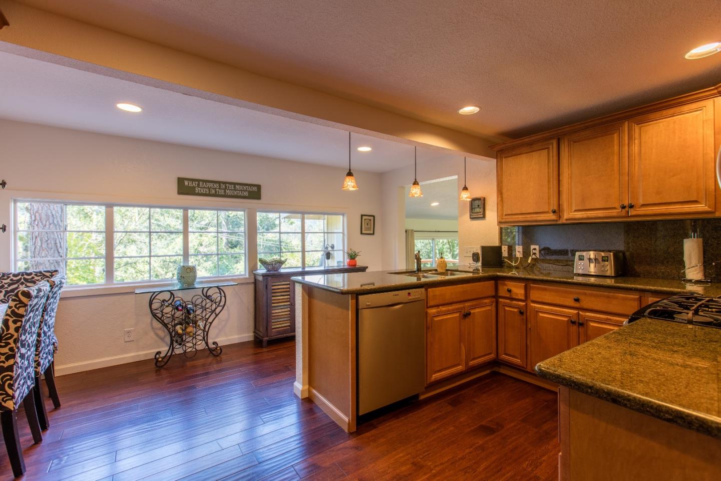 21477 Old Mine Road Los Gatos, CA 95033 - Photo 15 of 27 a kitchen with stainless steel appliances granite countertop sink stove top oven and cabinets