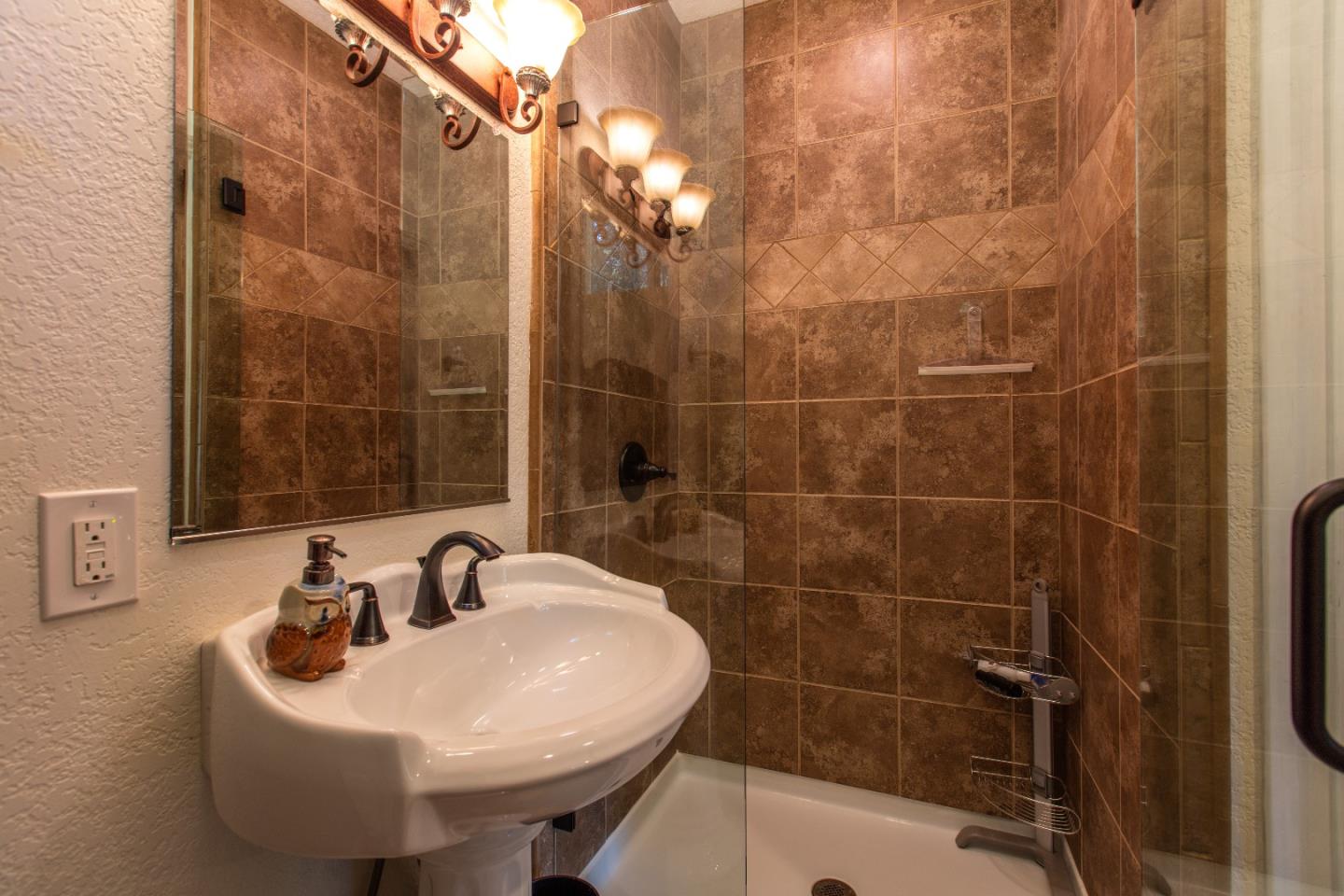 21477 Old Mine Road Los Gatos, CA 95033 - Photo 19 of 27 a bathroom with a sink shower and a mirror