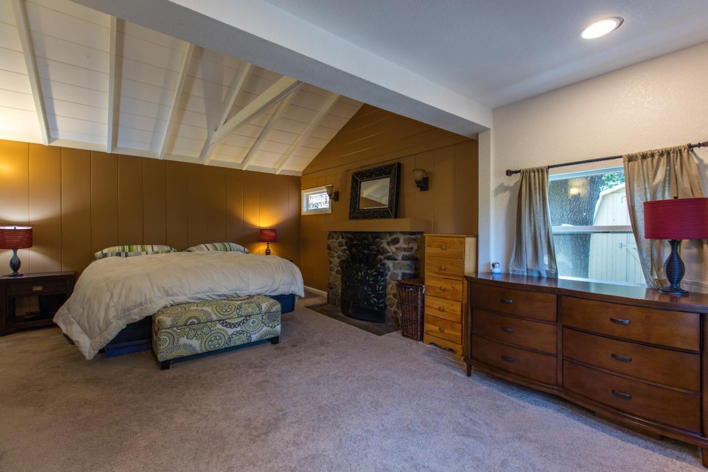 21477 Old Mine Road Los Gatos, CA 95033 - Photo 21 of 27 a bed room with a bed and a television