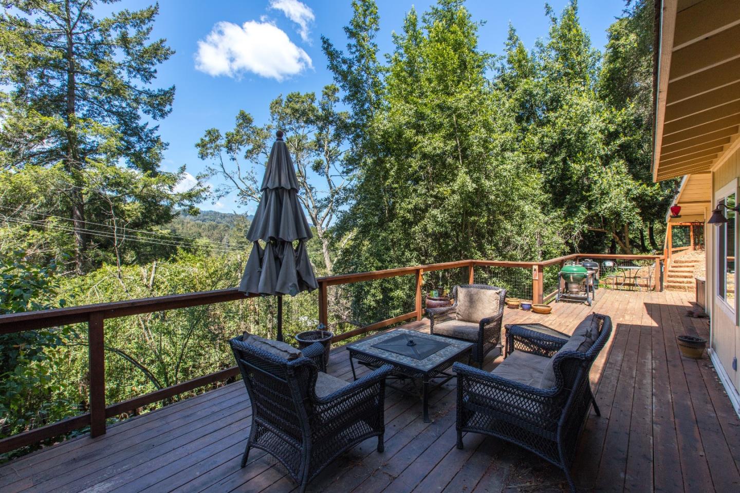 21477 Old Mine Road Los Gatos, CA 95033 - Photo 23 of 27 a view of a deck with wooden floor and outdoor seating