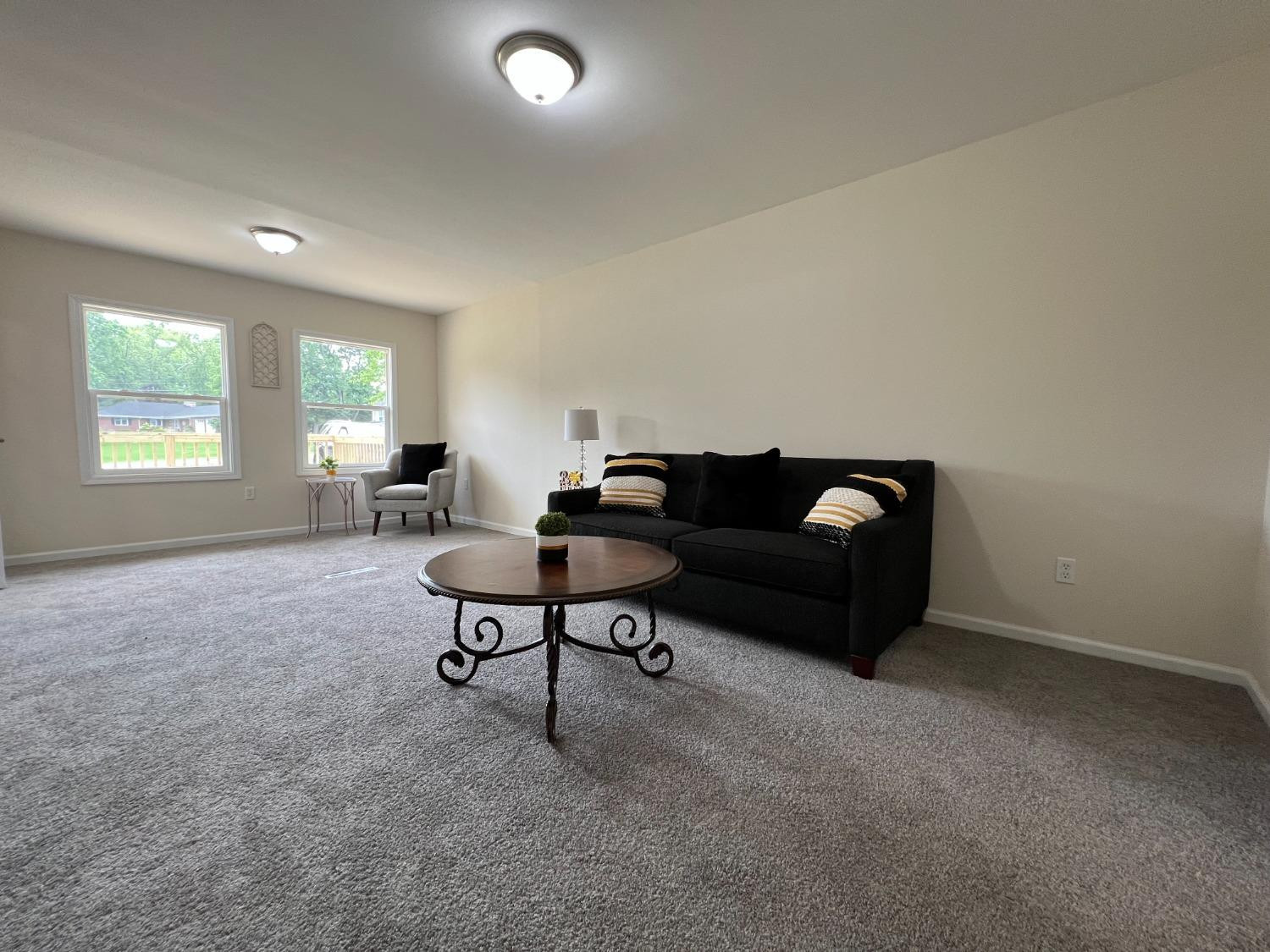 237 Krouser Drive Valparaiso, IN 46385 - Photo 13 of 31 a living room with furniture and a potted plant