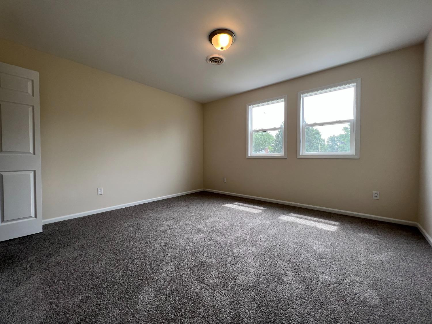 237 Krouser Drive Valparaiso, IN 46385 - Photo 22 of 31 an empty room with windows and