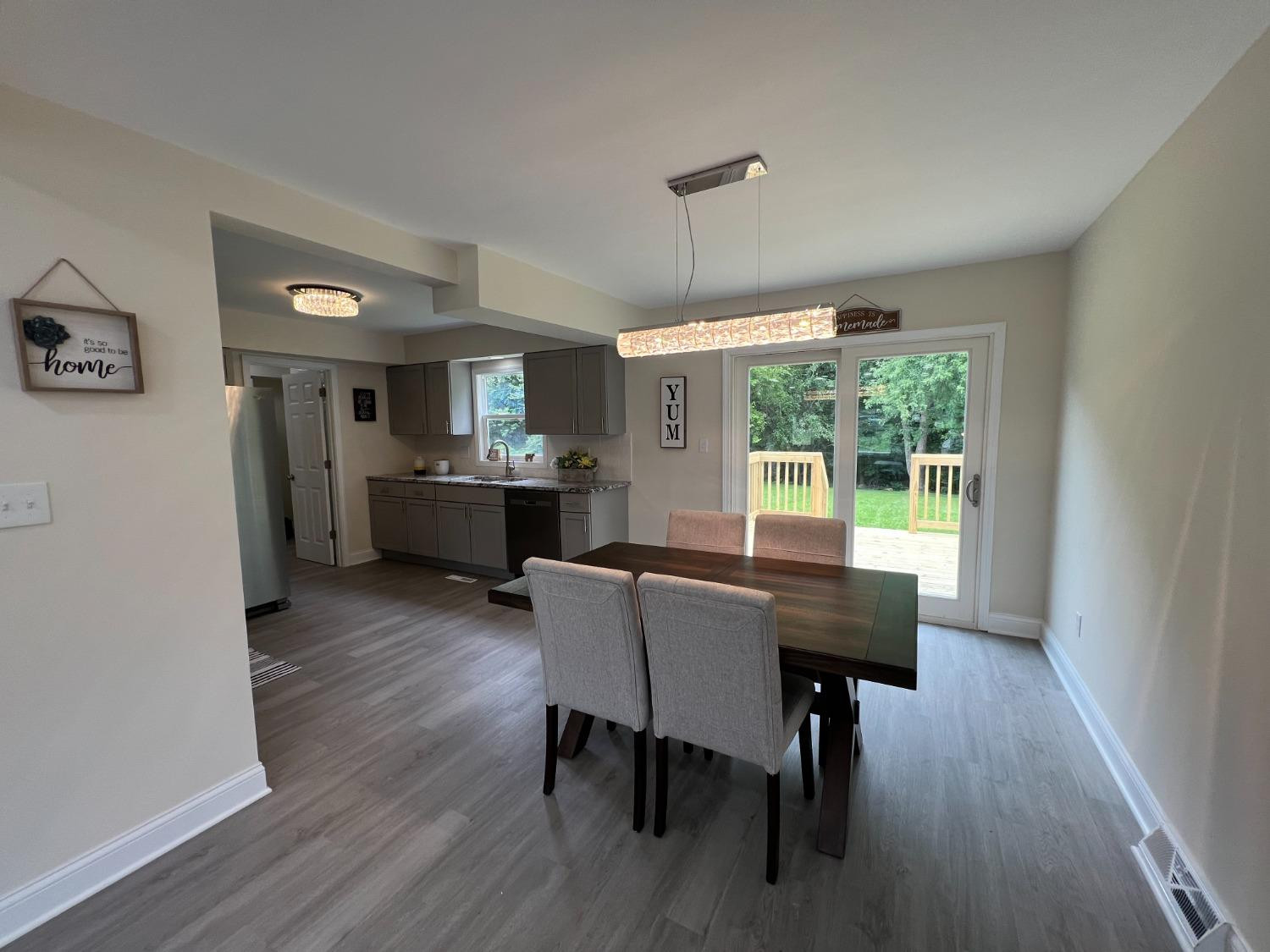 237 Krouser Drive Valparaiso, IN 46385 - Photo 6 of 31 a view of a dining room with furniture window and wooden floor