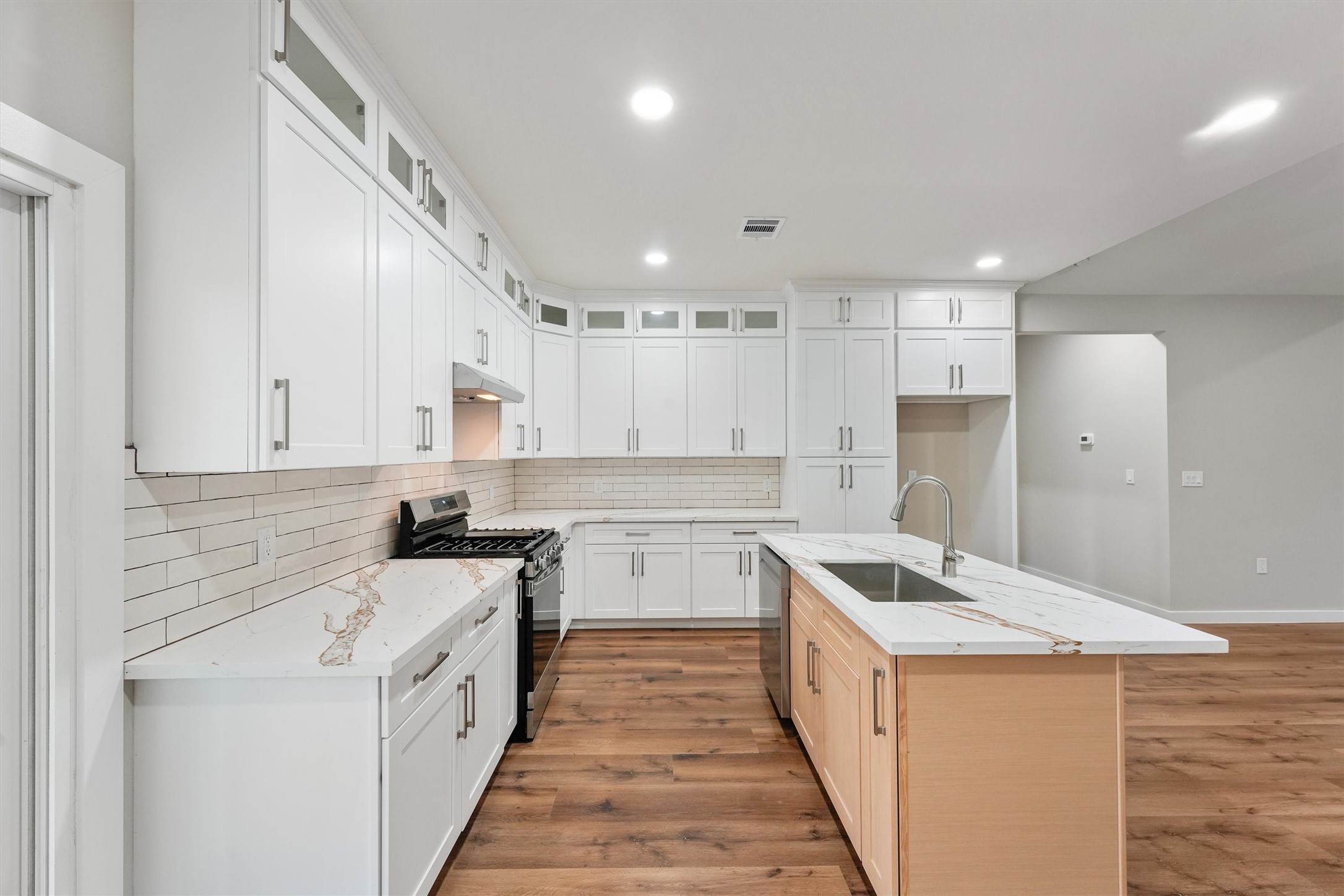 1208 Richard Avenue Pasadena, TX 77506 - Photo 13 of 27 a kitchen with a stove sink and refrigerator