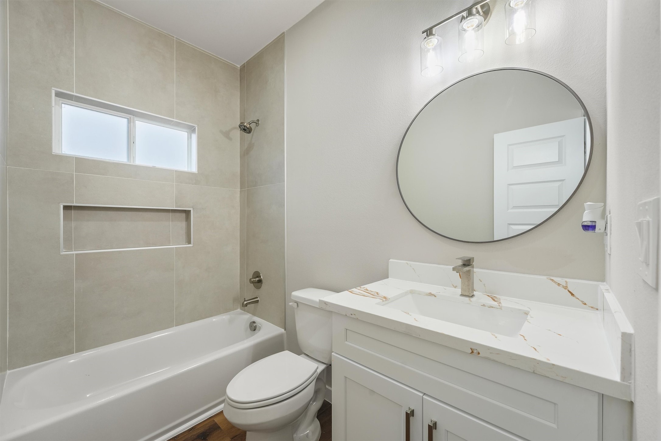 1208 Richard Avenue Pasadena, TX 77506 - Photo 17 of 27 a bathroom with a sink a toilet and a mirror