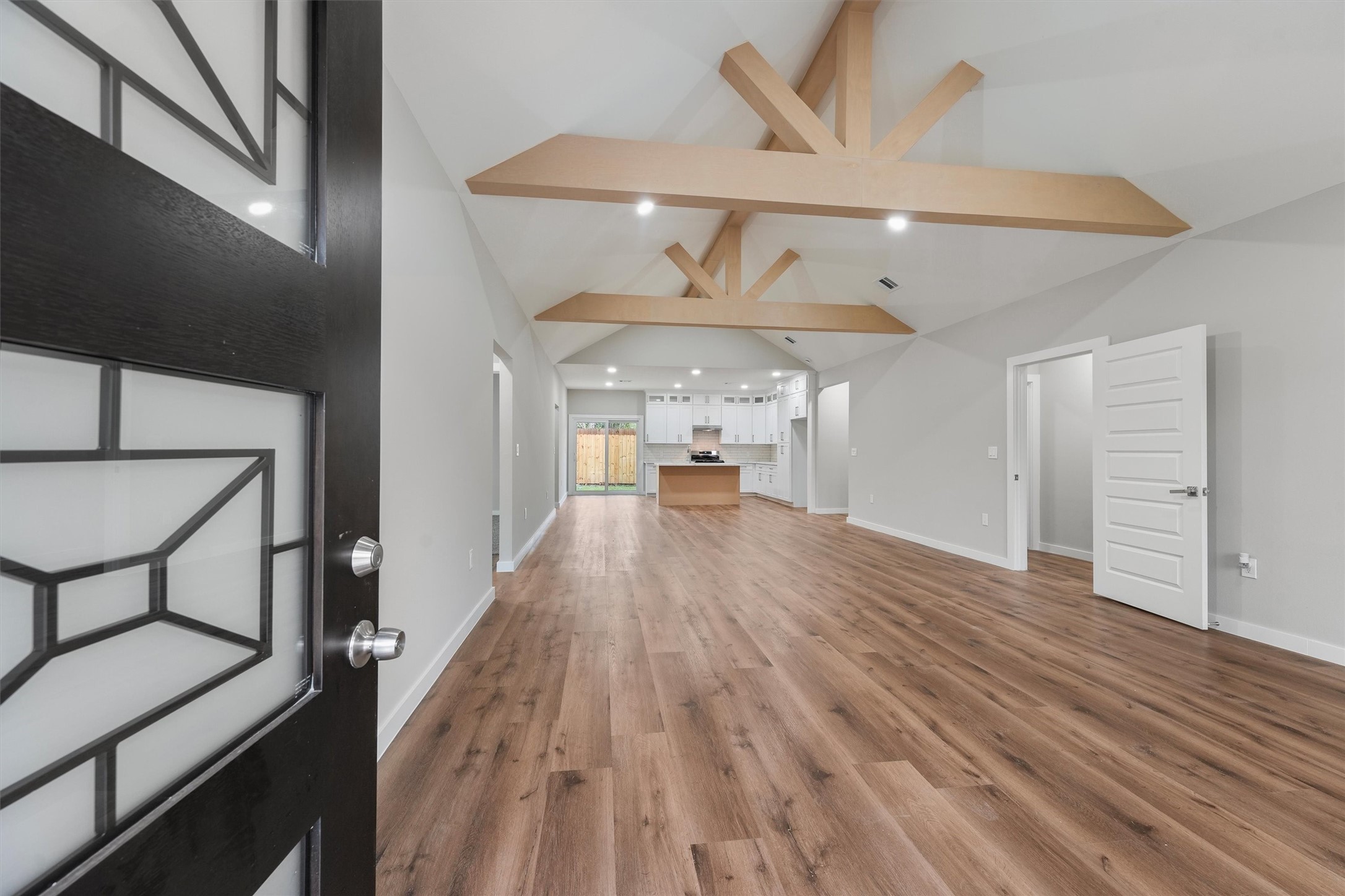 1208 Richard Avenue Pasadena, TX 77506 - Photo 5 of 27 a view of a living room a dining room wooden floor and a ceiling fan