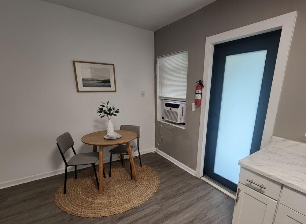664 West 2nd Street Riviera Beach, FL 33404 - Photo 4 of 10 a view of a dining room with furniture and wooden floor