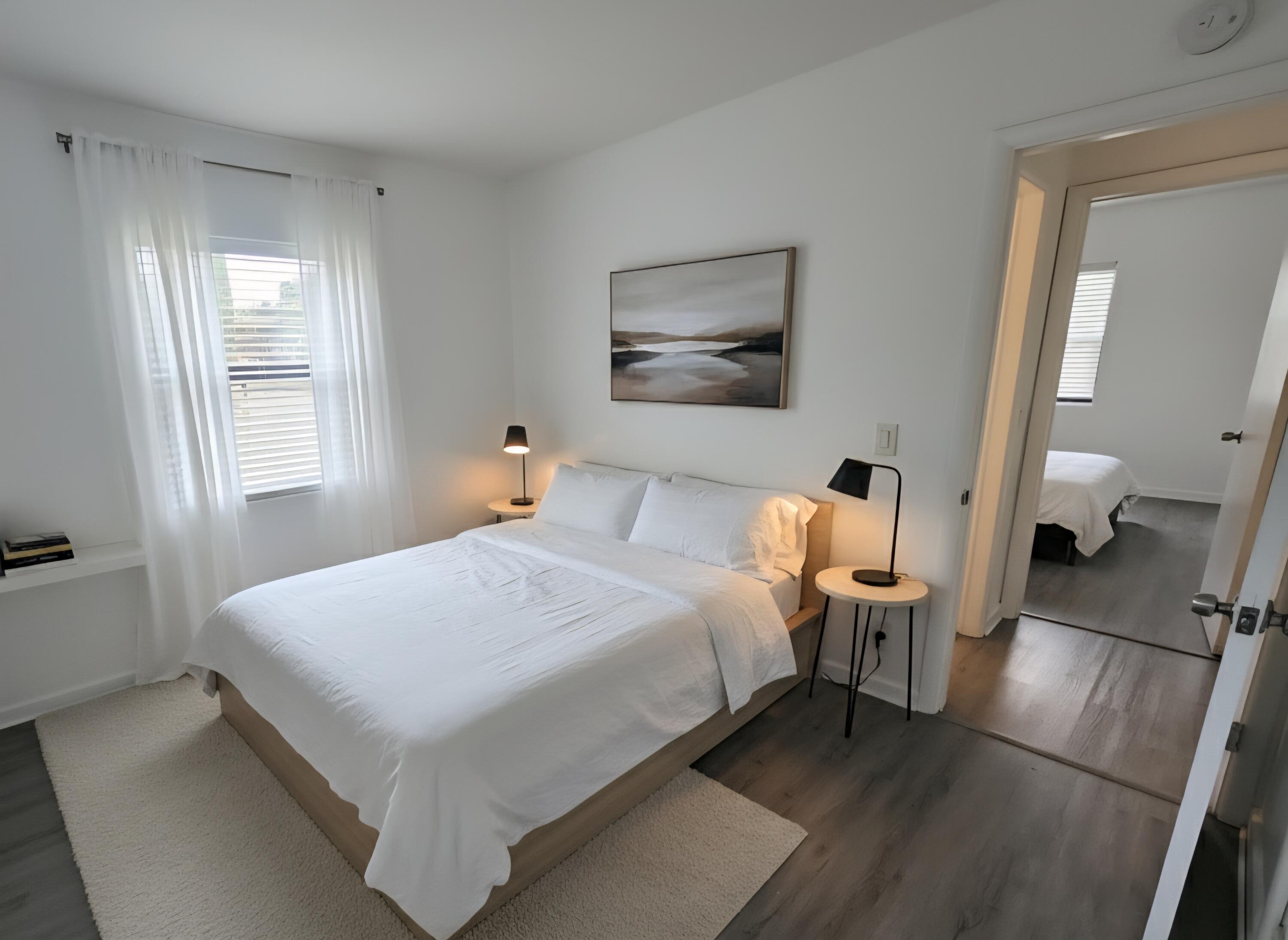 664 West 2nd Street Riviera Beach, FL 33404 - Photo 5 of 10 a bedroom with a bed and a large mirror