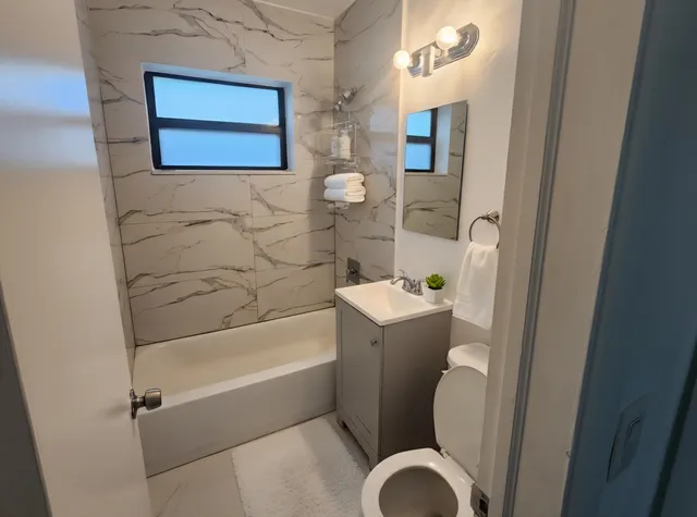 a bathroom with a toilet and sink