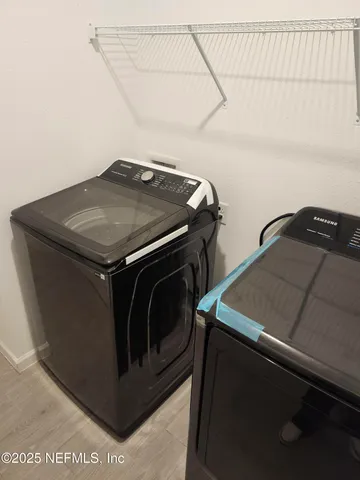 a utility room with dryer and washer