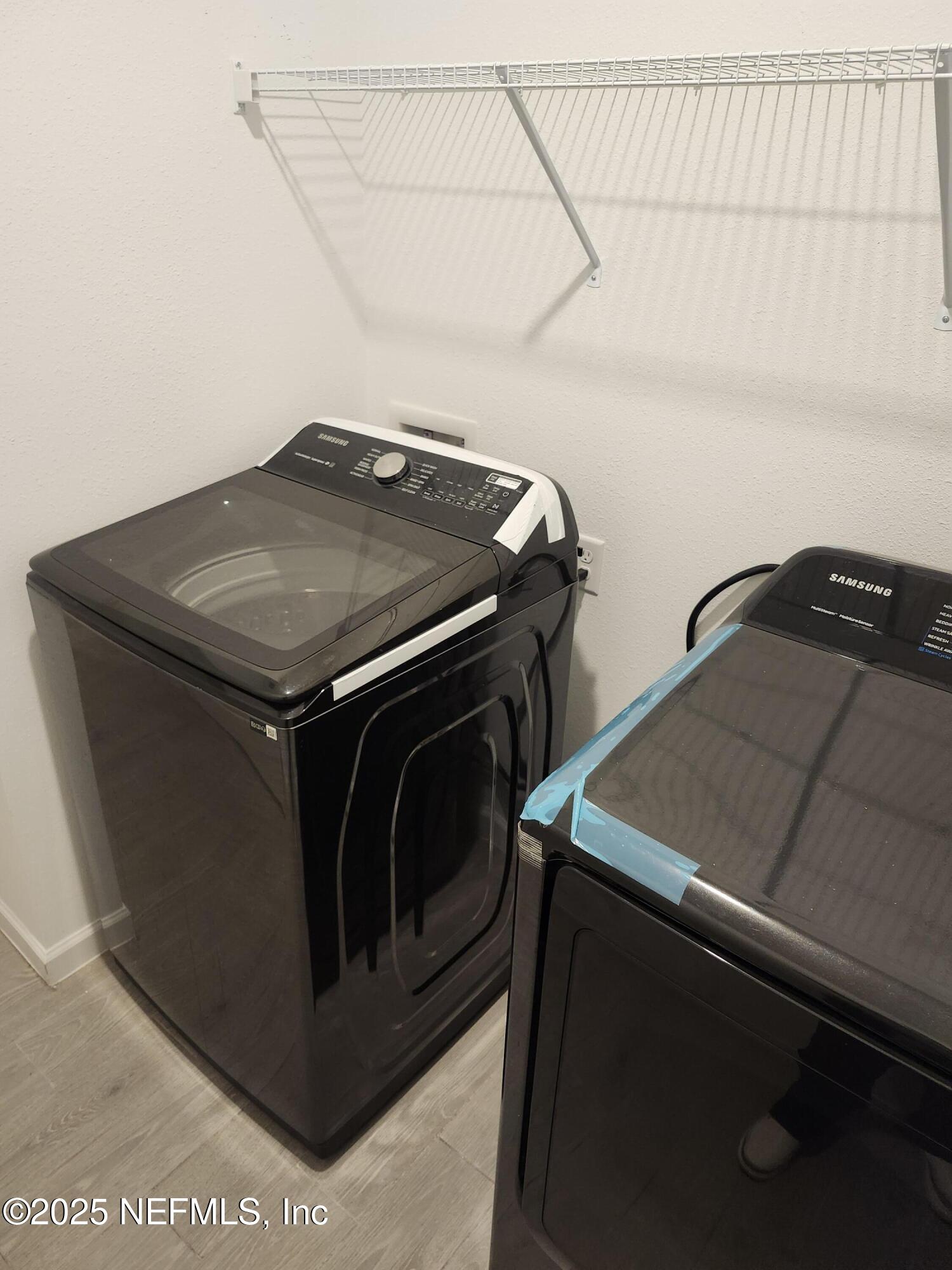 607 Lake Sinclair Street St. Augustine, FL 32084 - Photo 16 of 19 a utility room with dryer and washer