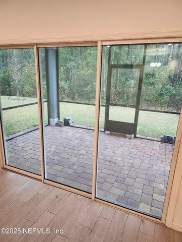 a view of porch with a floor to ceiling window
