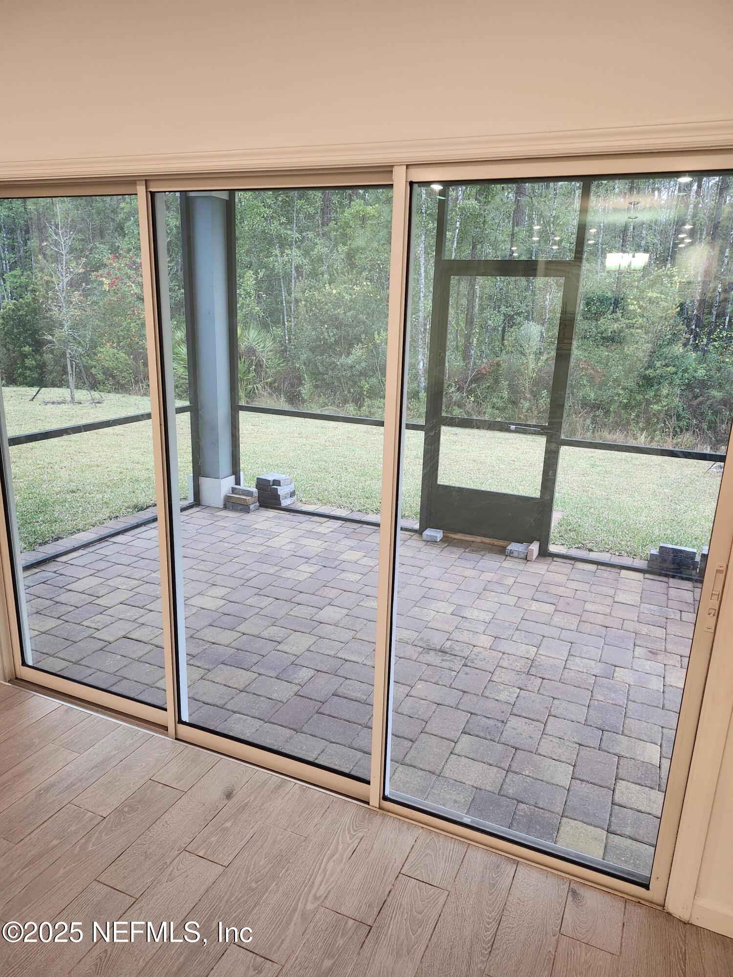 607 Lake Sinclair Street St. Augustine, FL 32084 - Photo 18 of 19 a view of porch with a floor to ceiling window