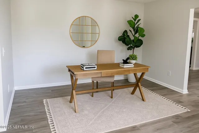 a kitchen with stainless steel appliances kitchen island granite countertop a stove a sink a dining table and chairs