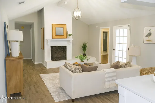 a spacious bathroom with a double vanity sink toilet and shower