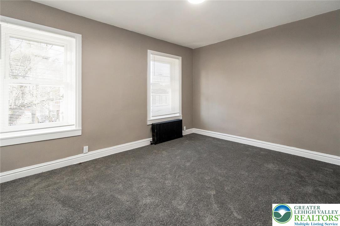 2213 Village Road Orefield, PA 18069 - Photo 9 of 41 an empty room with windows