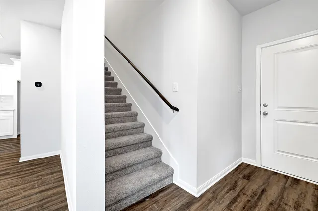 a view of entryway with wooden floor