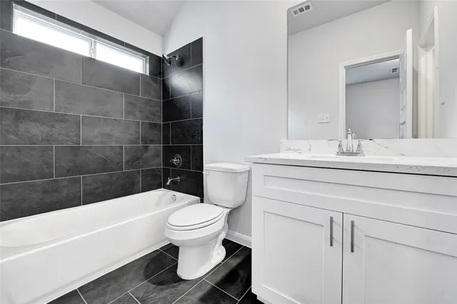 a bathroom with a sink toilet and bathtub