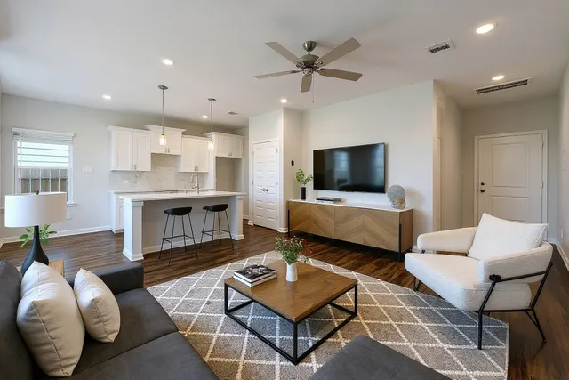 a living room with furniture and a flat screen tv