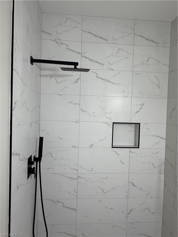 4281 22nd Avenue Southwest, Unit 80 Naples, FL 34116 - Photo 13 of 20 a bathroom with a shower