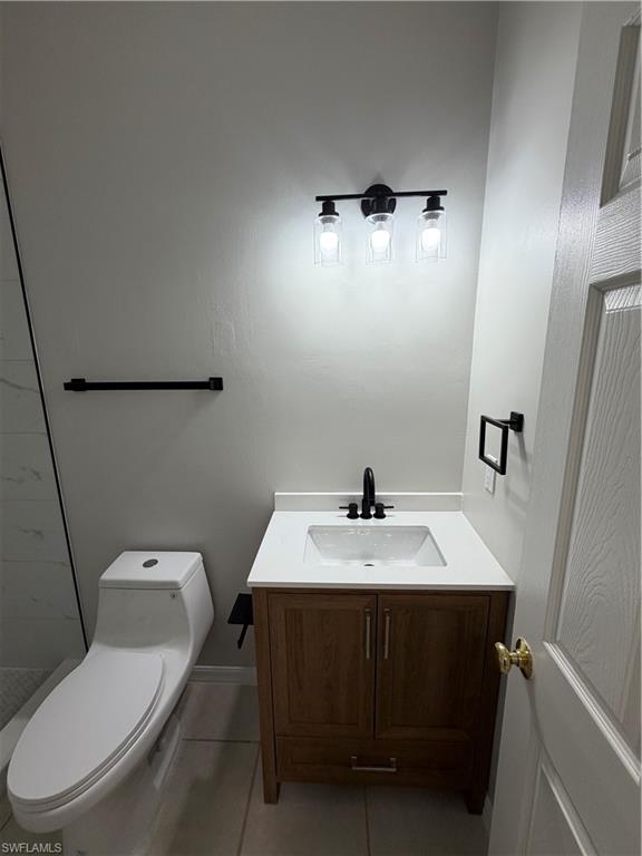 4281 22nd Avenue Southwest, Unit 80 Naples, FL 34116 - Photo 17 of 20 a bathroom with a toilet sink and mirror