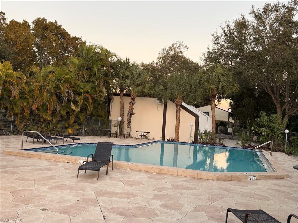 4281 22nd Avenue Southwest, Unit 80 Naples, FL 34116 - Photo 2 of 20 a view of a terrace with chairs