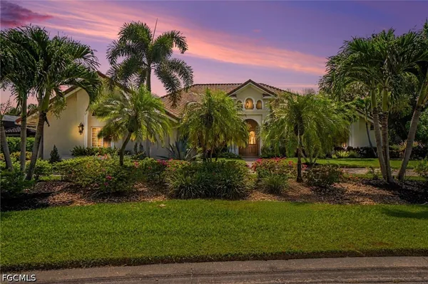 a view of a park with a house