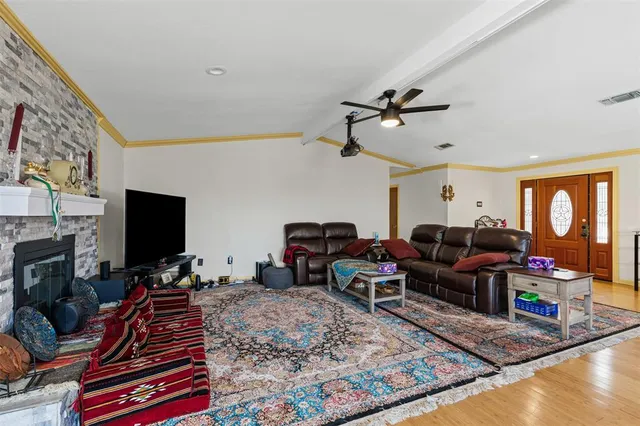 a large kitchen with stainless steel appliances and a refrigerator