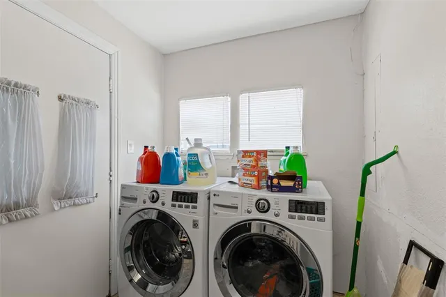 a living room with furniture and a rug