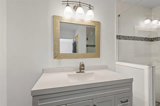 a spacious bedroom with a bed and a window