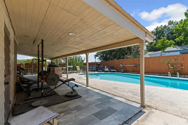a bedroom with a bed and flat screen tv