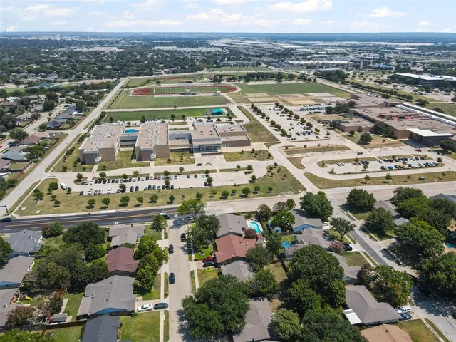 a view of a bench in the backyard of a house