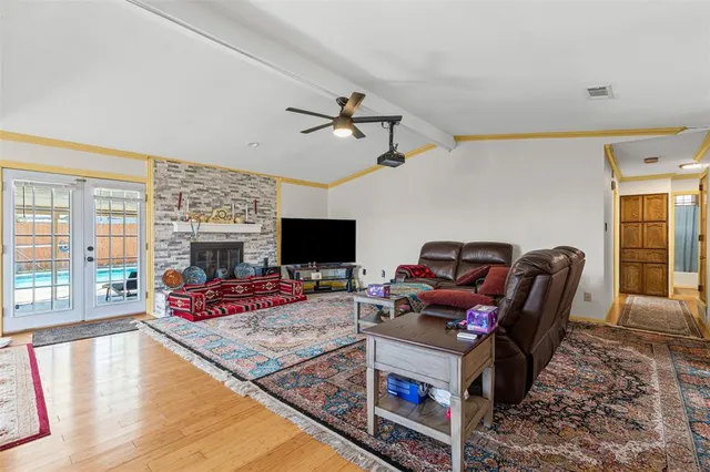 a living room with furniture fireplace and flat screen tv