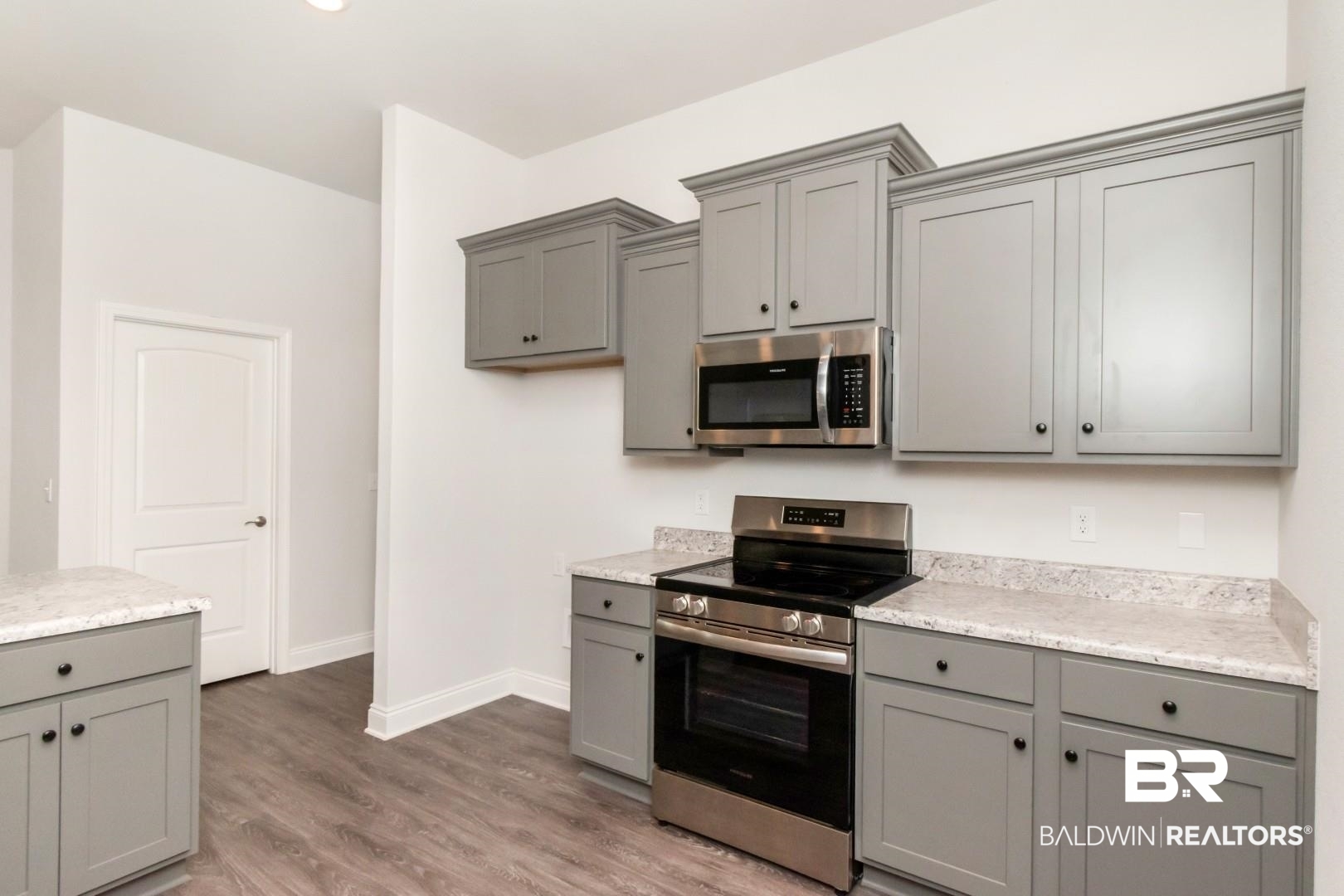6632 Monarch Circle Mobile, AL 36618 - Photo 8 of 32 Kitchen featuring stainless steel appliances, gray cabinets, and dark wood-type flooring