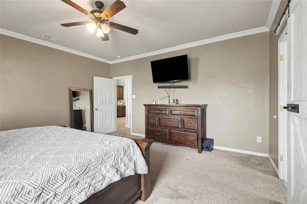 a bedroom with a bed and a couch