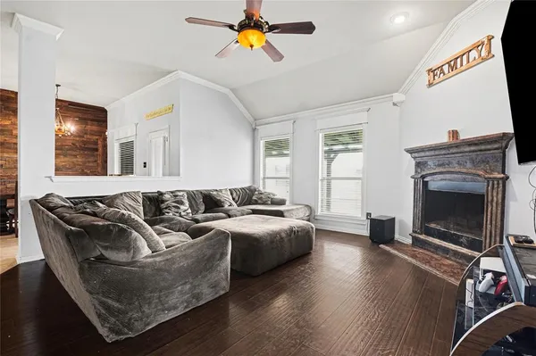 a living room with furniture and a fireplace