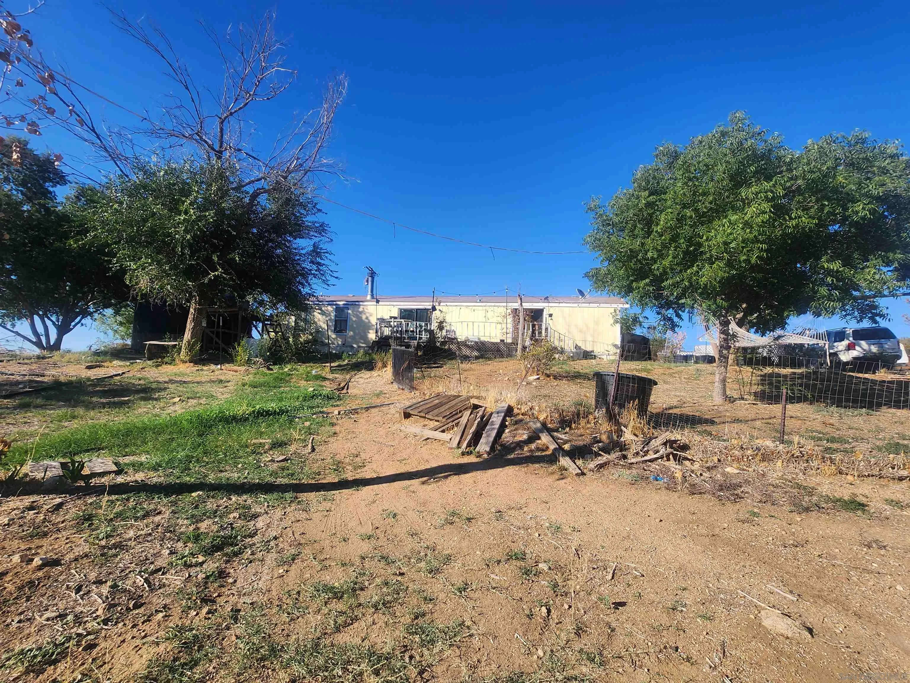 45251 Tule Fire Road Anza, CA 92539 - Photo 2 of 9 a view of swimming pool with a yard and sitting area