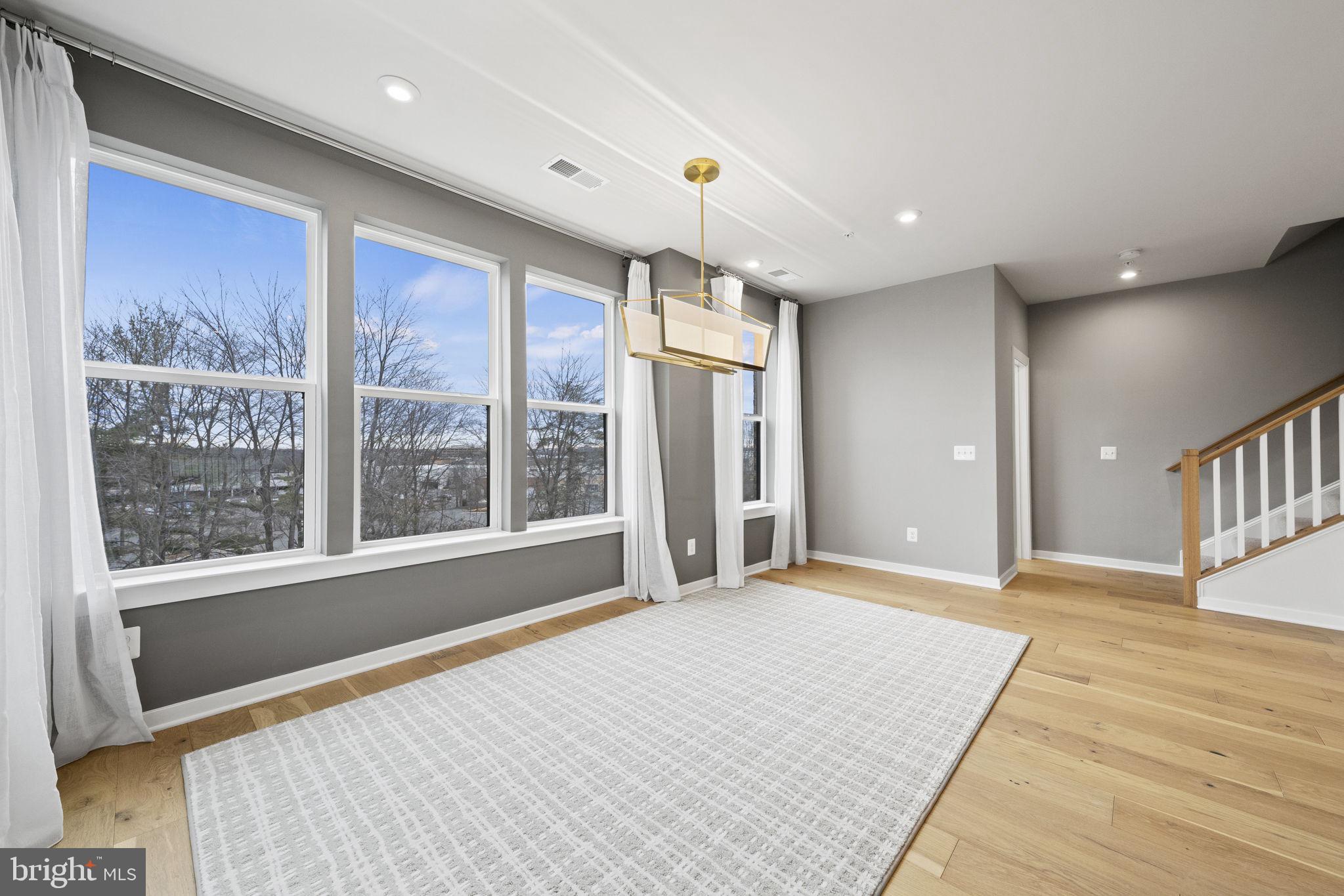 4118 Legato Road, Unit 60 Fairfax, VA 22033 - Photo 11 of 26 Large dining area with custom chandelier