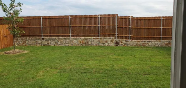 a kitchen with stainless steel appliances granite countertop a sink stove and microwave