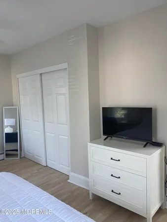 a room with furniture and flat screen tv