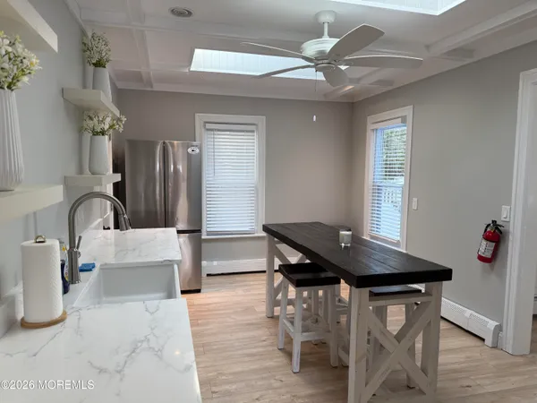 a dining room with furniture and window