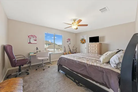 a spacious bathroom with a double vanity sink mirror and toilet