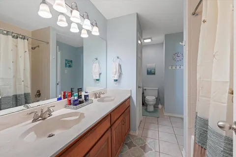 a bedroom with furniture and a chandelier