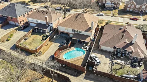 an aerial view of a house with a ocean view