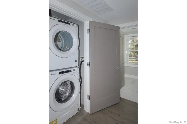 a view of a hallway with washer and dryer