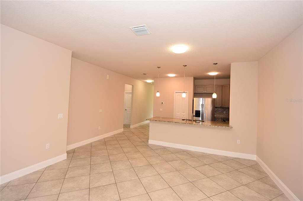 16 Serbian Bellflower Trail, Unit A Palm Coast, FL 32164 - Photo 17 of 41 a view of a kitchen with a sink and a vanity in microwave