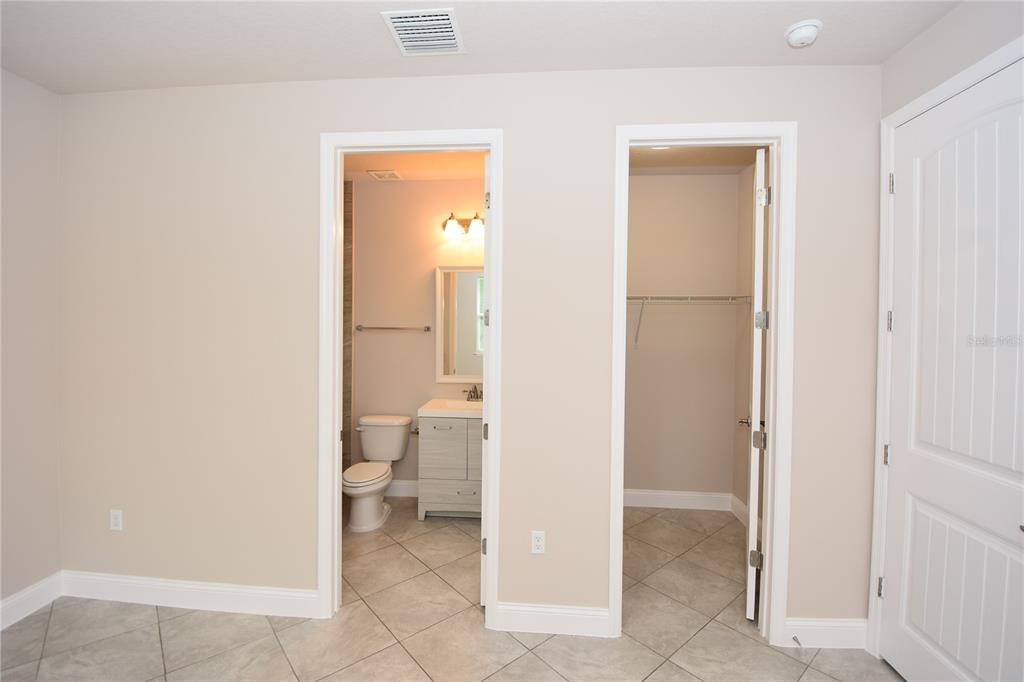 16 Serbian Bellflower Trail, Unit A Palm Coast, FL 32164 - Photo 21 of 41 a bathroom with a toilet